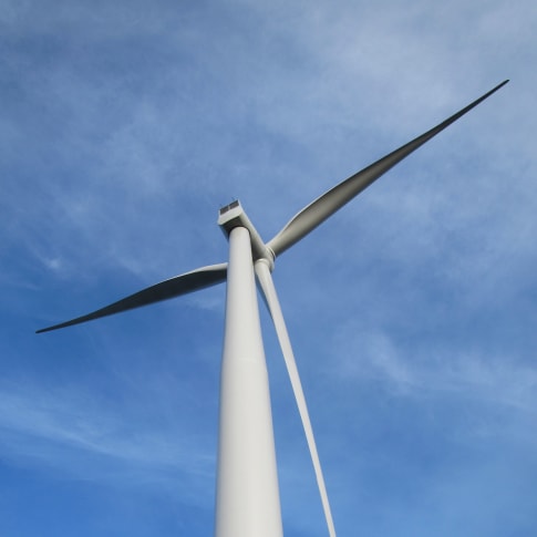 A Siemens wind turbine on a blue sky day